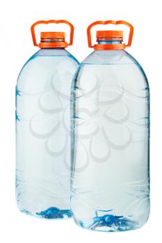 Two big full plastic water bottles with orange caps isolated on white background