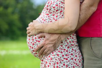 Royalty Free Photo of a Husband Holding His Pregnant Wife's Belly