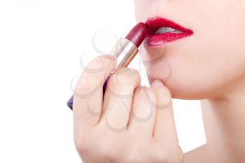 Royalty Free Photo of a Woman Applying Lipstick