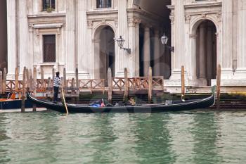 Gondola sailing in Venice channel
