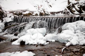 Winter waterfall in the forest