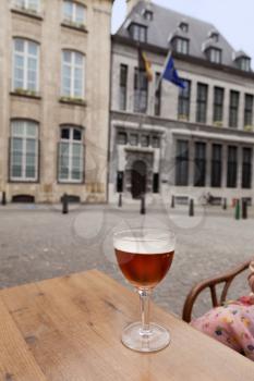 Glass of beer on table in street restaurant, Antwerpen, Belgium
