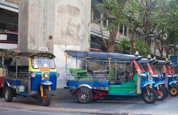 Line of tuktuks on Bangkok street, Thailand
