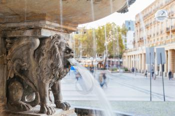 Lion statue and fountain on the square near Cologne cathedral, Germany
