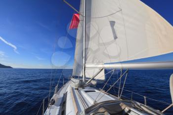 Sailing boat in the open blue sea
