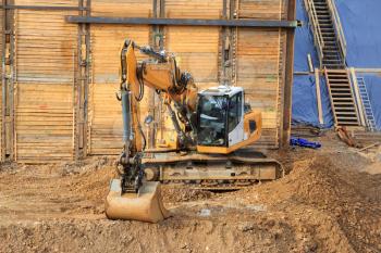 Excavator on the construction site digging the ground
