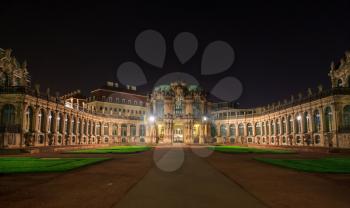 Dresden Zwinger palace panorama with illumination at night, Germany
