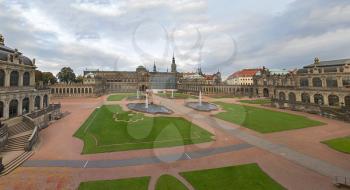 Dresden Zwinger palace panorama with fountains and park, Germany
