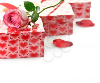 Royalty Free Photo of a Rose on Gift Boxes