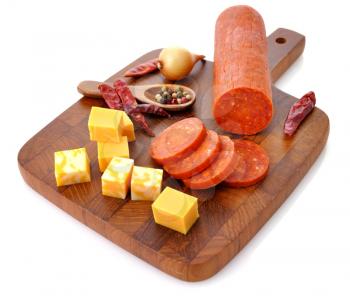 Royalty Free Photo of Meat and Cheese on a Cutting Board