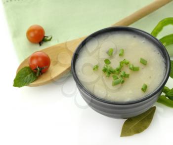 Royalty Free Photo of a Potato Cream Soup in a Black Bowl