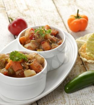 Bowls Of Vegetable Soup On Wooden Table