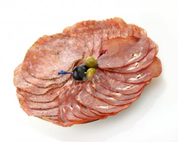 assortment of sliced and Smoked meat with spices in a plate