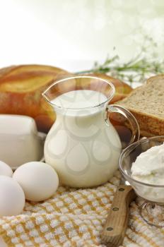 dairy products and Fresh eggs in glass containers 
