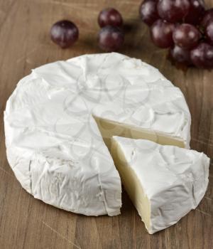 Brie Cheese On A Wooden Board