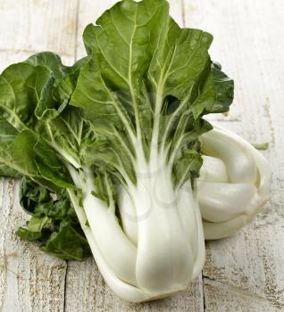 Fresh White Choy Sum Stalks With  Green Leaves ,Close Up