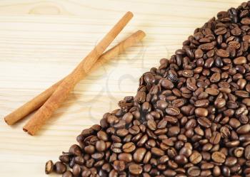 arrangement of coffee beans and cinnamon sticks