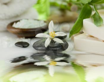 spa items - sea salt ,massage stones and soap 