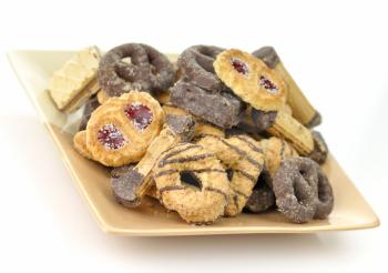 assortment of cookies and wafers on a plate , close up