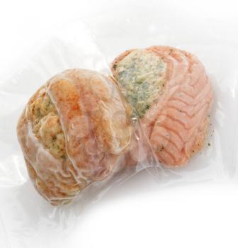 Frozen Stuffed Salmon And Tilapia Fillets In A Vacuum Package