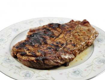 a fresh grilled steak on a plate  ,close up
