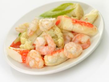 cooked shrimps with crab meat and vegetables