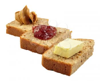 bread with jelly , peanut butter and butter on white background