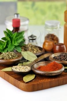 arrangement of spices on a wooden board , close up 