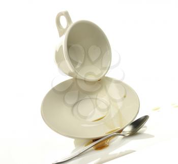 Cup and saucer with spilled coffee 