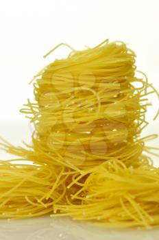 pasta nests on white background , close up