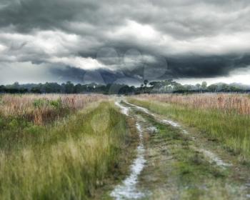 Dirt Country Road And Stormy Weather