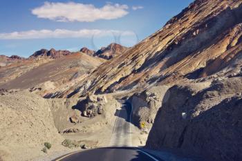 Desert road leading through Death Valley National Park, California USA.Artist's Palette scenic drive.