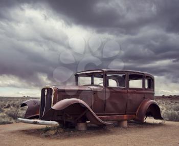 Route 66 vintage car relic displayed near the north entrance of Petrified Forest National Park in Arizona, USA