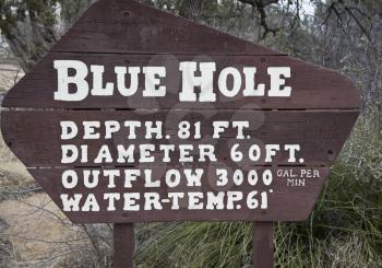 Blue Hole Sign .
The Blue Hole of Santa Rosa is a circular, bell-shaped pool east of Santa Rosa, New Mexico