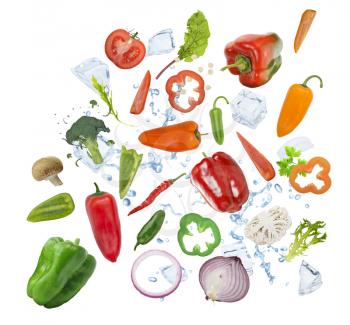 Colorful fresh vegetables with ice cubes isolated on white background
