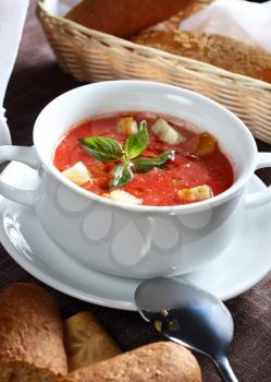 Delicious cold Gazpacho soup in white bowl 