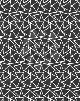 Inked overlapping triangles on black.Hand drawn with ink seamless background.Monochrome rough texture.