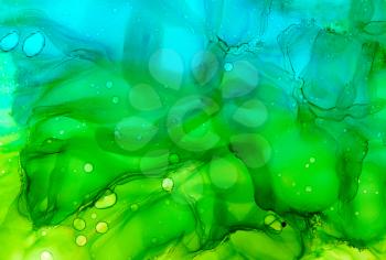 Abstract backdrop blue to green.Colorful painted background hand drawn with bright inks and watercolor paints. Bright color splashes and splatters create uneven artistic background.