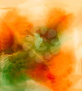 Abstract green orange smudge.Colorful background hand drawn with bright inks and watercolor paints. Color splashes and splatters create uneven artistic modern design.