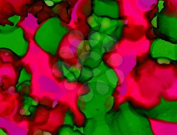 Abstract painted pink green merging uneven.Colorful background hand drawn with bright inks and watercolor paints. Color splashes and splatters create uneven artistic modern design.