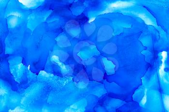 Abstract textured painted royal blue.Colorful background hand drawn with bright inks and watercolor paints. Color splashes and splatters create uneven artistic modern design.