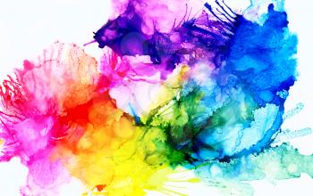 Rainbow colored splashes.Colorful background hand drawn with bright inks and watercolor paints. Color splashes and splatters create uneven artistic modern design.