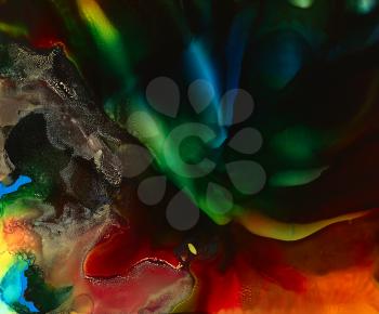 Dark multicolored smooth paint flow with texture.Colorful background hand drawn with bright inks and watercolor paints. Color splashes and splatters create uneven artistic modern design.