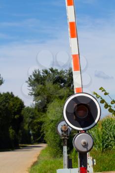 level crossing gate at a sunny day