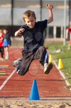 a cute jumping young kid