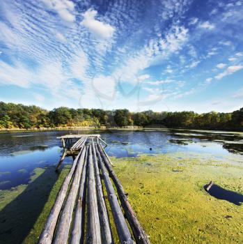 Royalty Free Photo of a Footbridge on a Lake