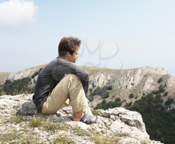Royalty Free Photo of a Boy on a Cliff