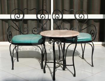 Royalty Free Photo of a Bistro Table and Chairs