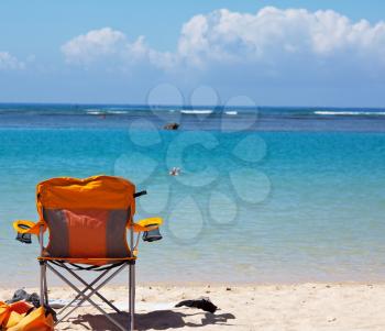 Royalty Free Photo of a Camp Chair on a Beach