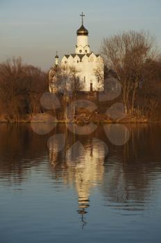 Royalty Free Photo of a White Church and Water Reflection